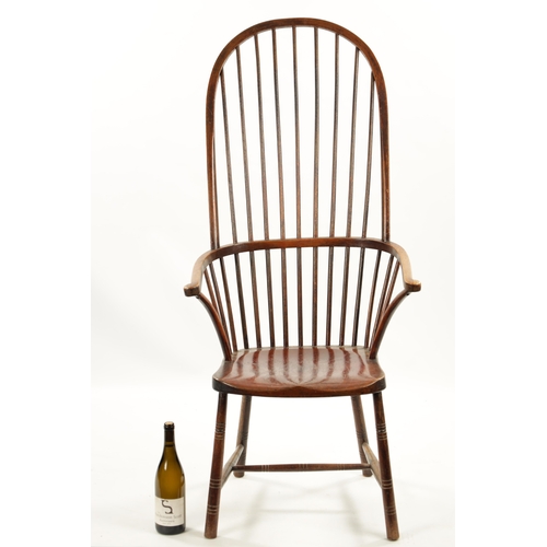 327 - A 19TH CENTURY PRIMITIVE PAINTED STICK BACK WINDSOR ARMCHAIR having an unusual high back raised on r... 