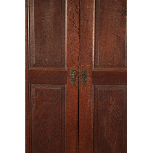 33 - A SMALL EARLY 18TH CENTURY OAK PANELLED CUPBOARD with ironwork H hinges (92cm wide 46cm deep 159cm h... 