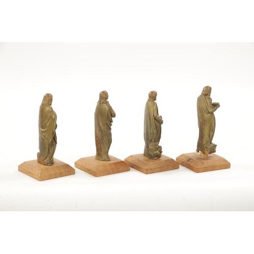 342 - A SET OF FOUR 19TH CENTURY BRONZE APOSTLES mounted on square oak bases - believed to be from Moor ho... 