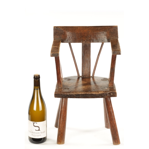 343 - A RARE 18TH CENTURY PRIMITIVE ASH AND ELM CHILD'S CHAIR with bar back and raised arms. (48cm high 29... 