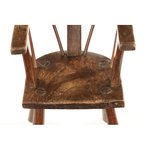 343 - A RARE 18TH CENTURY PRIMITIVE ASH AND ELM CHILD'S CHAIR with bar back and raised arms. (48cm high 29... 