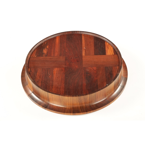 344 - A CIRCULAR CONTEMPORARY SEGMENTED HARDWOOD BOWL BY COCOBOLO, DENMARK bearing stamp beneath. (43cm di... 