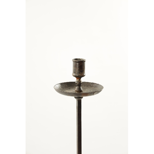 347 - AN 18TH / 19TH CENTURY WROUGHT IRON FLOOR STANDING CANDLESTICK with X framed base (118cm high)