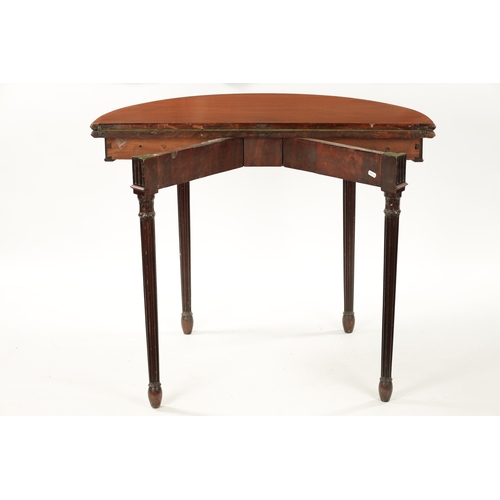 349 - A GEORGE III MAHOGANY DEMI LUNE CARD TABLE IN THE MANNER OF ROBERT ADAM the cross banded top with ba... 