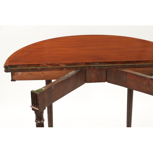 349 - A GEORGE III MAHOGANY DEMI LUNE CARD TABLE IN THE MANNER OF ROBERT ADAM the cross banded top with ba... 