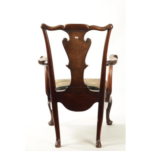 352 - AN 18TH CENTURY FIGURED MAHOGANY COMMODE CHAIR with shaped back splats scrolled arms and short cabri... 