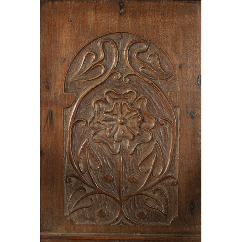 357 - A 17TH CENTURY WAINSCOT CHAIR WITH TUDOR ROSE with shaped carved top rail, plank seat and turned sup... 