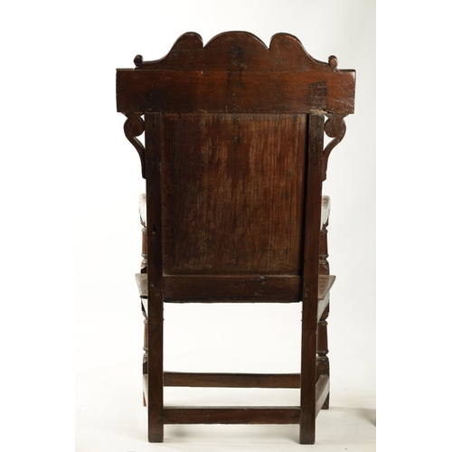 357 - A 17TH CENTURY WAINSCOT CHAIR WITH TUDOR ROSE with shaped carved top rail, plank seat and turned sup... 