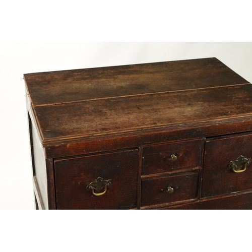 358 - AN EARLY 19TH CENTURY OAK NORFOLK / SUFFOLK CHEST OF DRAWERS having an unusual drawer configuration.... 