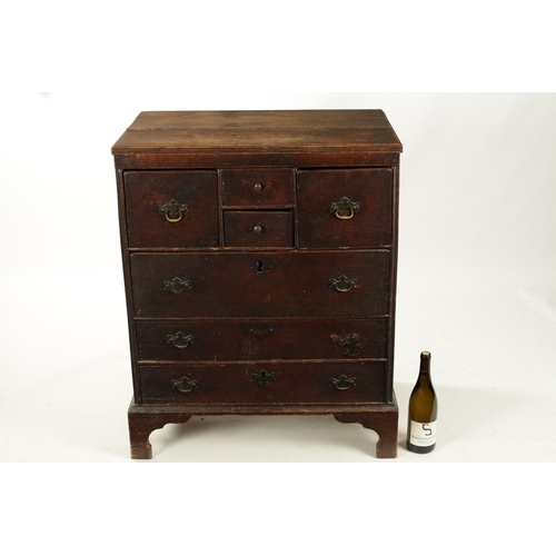 358 - AN EARLY 19TH CENTURY OAK NORFOLK / SUFFOLK CHEST OF DRAWERS having an unusual drawer configuration.... 