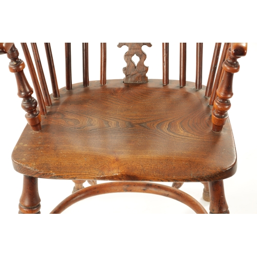 359 - AN EARLY 19TH CENTURY NOTTINGHAMSHIRE YEW-WOOD LOW BACK WINDSOR CHAIR with saddle seat and crinoline... 