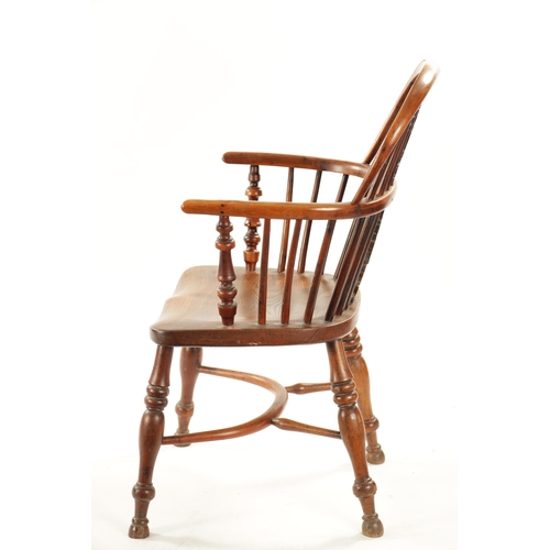 359 - AN EARLY 19TH CENTURY NOTTINGHAMSHIRE YEW-WOOD LOW BACK WINDSOR CHAIR with saddle seat and crinoline... 