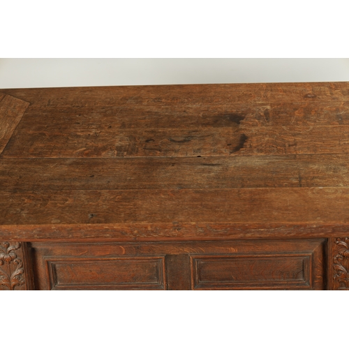 36 - AN 18TH CENTURY FLEMISH OAK TABLE with sliding top above a panelled frieze, ring turned bulbous legs... 