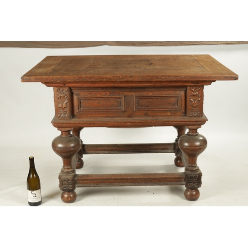 36 - AN 18TH CENTURY FLEMISH OAK TABLE with sliding top above a panelled frieze, ring turned bulbous legs... 