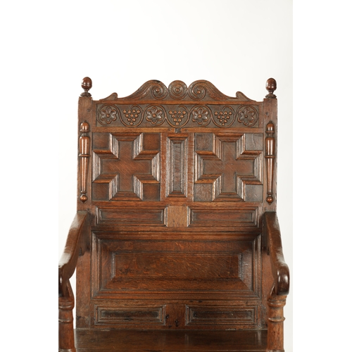 360 - A 17TH CENTURY CARVED OAK JACOBEAN STYLE WAINSCOT CHAIR with grape and floral top rail (56cm wide 11... 