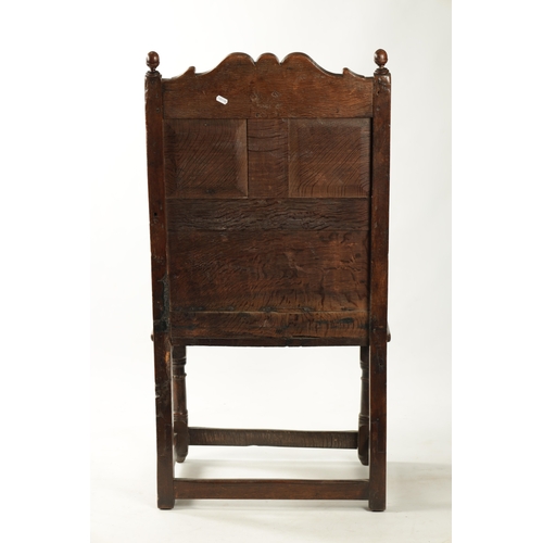 360 - A 17TH CENTURY CARVED OAK JACOBEAN STYLE WAINSCOT CHAIR with grape and floral top rail (56cm wide 11... 