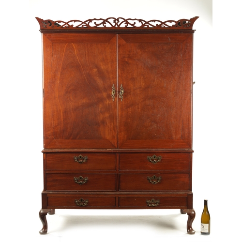 361 - AN UNUSUAL GEORGE II MAHOGANY PRESS CUPBOARD of three sections with pierced cornice above a pair of ... 