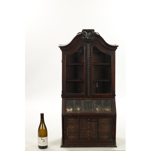 362 - AN 18TH CENTURY APPRENTICE MINIATURE BUREAU BOOKCASE with hinged glazed doors and fitted small drawe... 