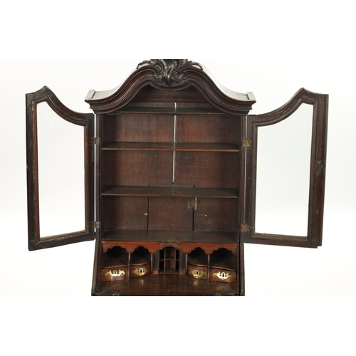 362 - AN 18TH CENTURY APPRENTICE MINIATURE BUREAU BOOKCASE with hinged glazed doors and fitted small drawe... 