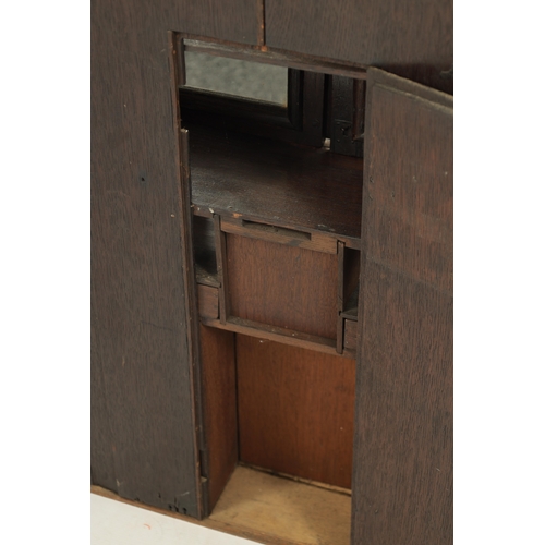 362 - AN 18TH CENTURY APPRENTICE MINIATURE BUREAU BOOKCASE with hinged glazed doors and fitted small drawe... 