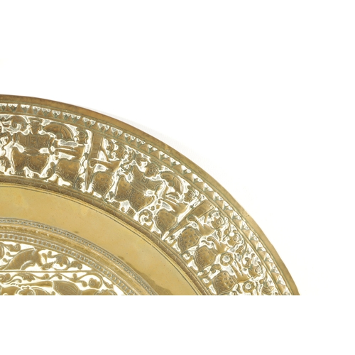 366 - A LATE 19TH CENTURY INDIAN EMBOSSED BRASS OVAL TRAY (61cm wide 52cm deep)