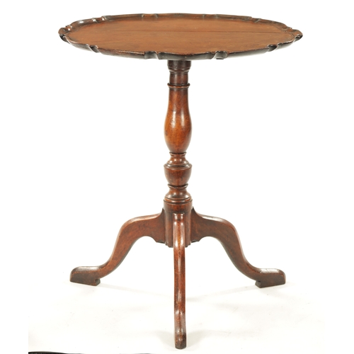 37 - AN 18TH CENTURY COUNTRY MADE MAHOGANY TILT TOP TRIPOD TABLE having a pie crust top with vase shaped ... 