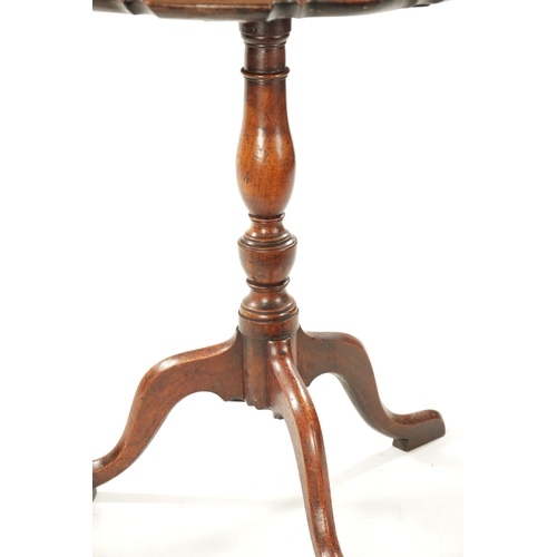 37 - AN 18TH CENTURY COUNTRY MADE MAHOGANY TILT TOP TRIPOD TABLE having a pie crust top with vase shaped ... 