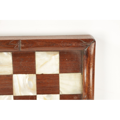 373 - A 19TH CENTURY CHINESE SIMULATED BAMBOO CARVED HARDWOOD AND MOTHER OF PEARL CHEQUERED GAMES BOARD