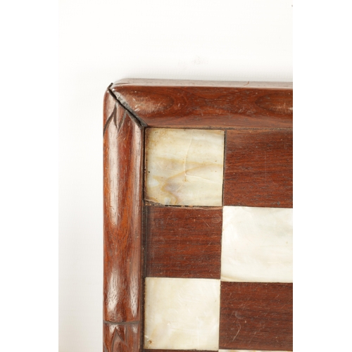 373 - A 19TH CENTURY CHINESE SIMULATED BAMBOO CARVED HARDWOOD AND MOTHER OF PEARL CHEQUERED GAMES BOARD