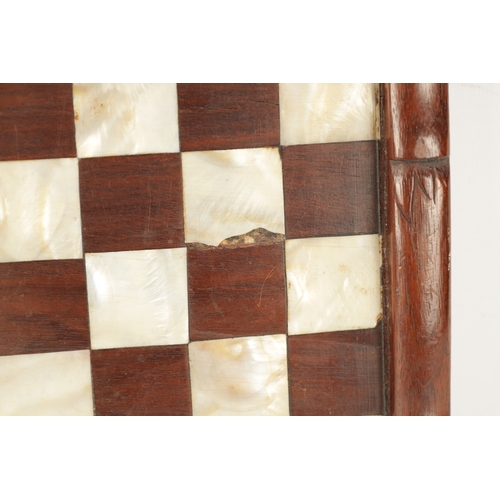 373 - A 19TH CENTURY CHINESE SIMULATED BAMBOO CARVED HARDWOOD AND MOTHER OF PEARL CHEQUERED GAMES BOARD