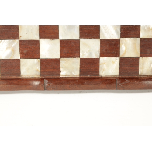 373 - A 19TH CENTURY CHINESE SIMULATED BAMBOO CARVED HARDWOOD AND MOTHER OF PEARL CHEQUERED GAMES BOARD