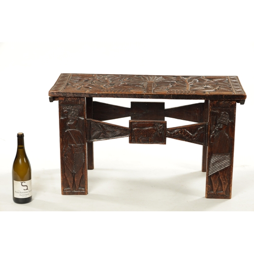 375 - A CARVED HARDWOOD ASHANTI NATIVE OCCASIONAL TABLE (81cm wide 38cm deep 46cm high)