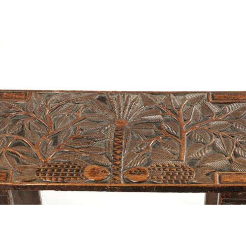 375 - A CARVED HARDWOOD ASHANTI NATIVE OCCASIONAL TABLE (81cm wide 38cm deep 46cm high)