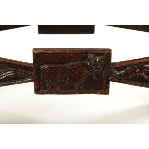 375 - A CARVED HARDWOOD ASHANTI NATIVE OCCASIONAL TABLE (81cm wide 38cm deep 46cm high)