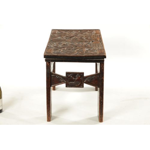 375 - A CARVED HARDWOOD ASHANTI NATIVE OCCASIONAL TABLE (81cm wide 38cm deep 46cm high)