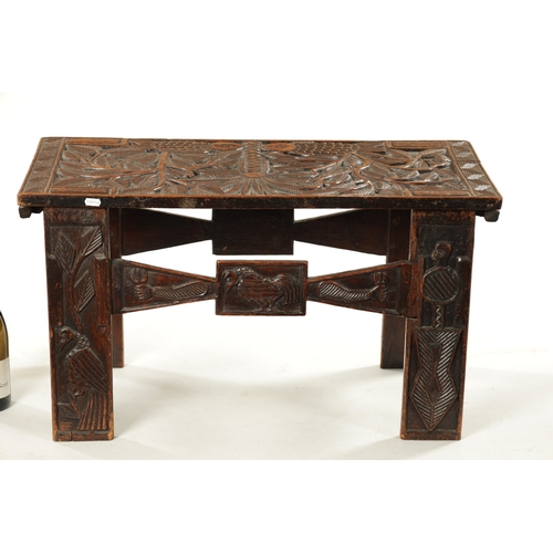 375 - A CARVED HARDWOOD ASHANTI NATIVE OCCASIONAL TABLE (81cm wide 38cm deep 46cm high)