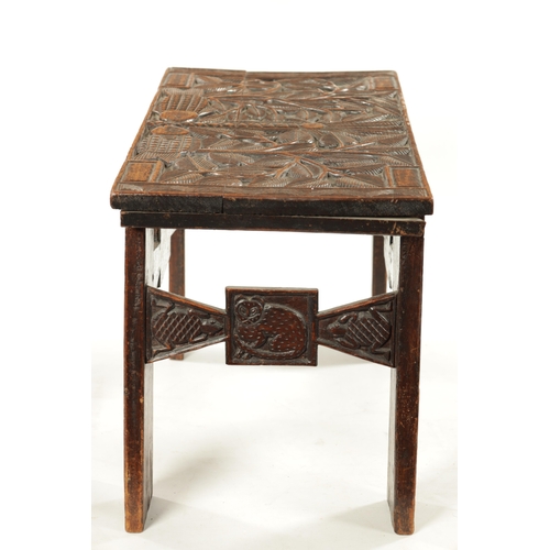 375 - A CARVED HARDWOOD ASHANTI NATIVE OCCASIONAL TABLE (81cm wide 38cm deep 46cm high)