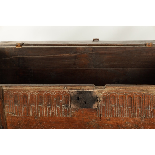 377 - A RARE LATE 16TH CENTURY WELSH OAK BOARDED CHEST with arcaded frieze; raised on thick cut stile feet... 