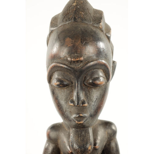 378 - AN ANTIQUE CARVED WOOD BAULE FERTILITY FIGURE with label 'the Eric Mayes Collection' (59cm high)