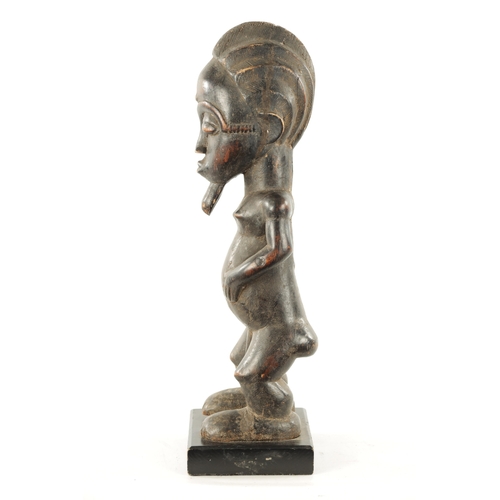 378 - AN ANTIQUE CARVED WOOD BAULE FERTILITY FIGURE with label 'the Eric Mayes Collection' (59cm high)