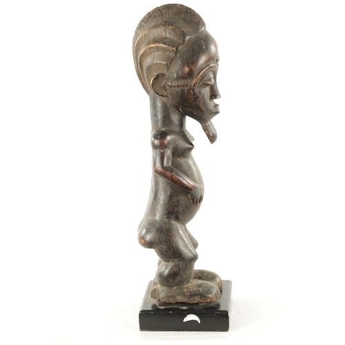 378 - AN ANTIQUE CARVED WOOD BAULE FERTILITY FIGURE with label 'the Eric Mayes Collection' (59cm high)