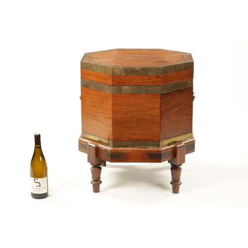 379 - AN UNUSUAL 18TH CENTURY COLONIAL PADOUK OCTAGONAL SHAPED WINE COOLER ON STAND with brass bound egdes... 