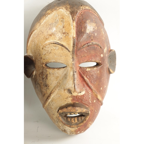 38 - THREE ANTIQUE TRIBAL NATIVE MASKS with polychrome decoration (28cm high and smaller)