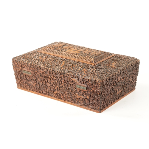 390 - A 19TH CENTURY INDIAN CARVED HARDWOOD SEWING BOX with fitted interior. (25cm wide 17.5cm deep 9.5cm ... 