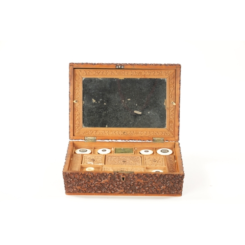 390 - A 19TH CENTURY INDIAN CARVED HARDWOOD SEWING BOX with fitted interior. (25cm wide 17.5cm deep 9.5cm ... 