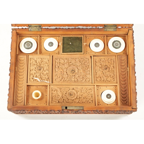 390 - A 19TH CENTURY INDIAN CARVED HARDWOOD SEWING BOX with fitted interior. (25cm wide 17.5cm deep 9.5cm ... 