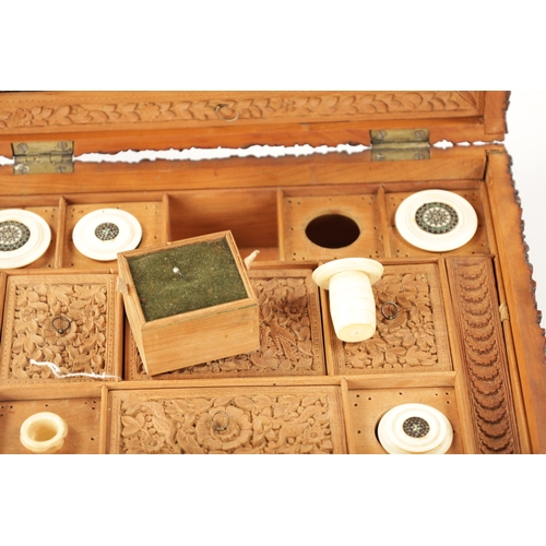 390 - A 19TH CENTURY INDIAN CARVED HARDWOOD SEWING BOX with fitted interior. (25cm wide 17.5cm deep 9.5cm ... 