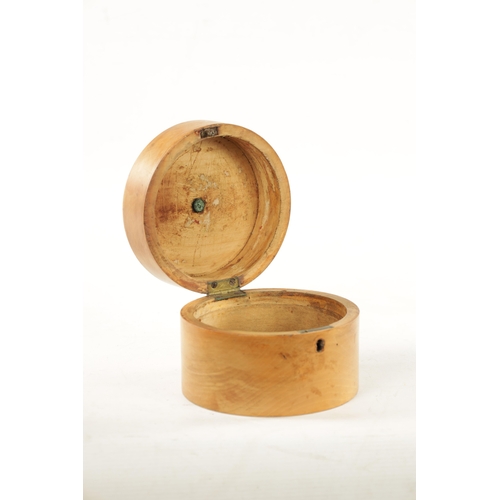 391 - A 19TH CENTURY FRUITWOOD CYLINDRICAL TEA CADDY with burr yew wood lid. (15cm diameter 11cm high)