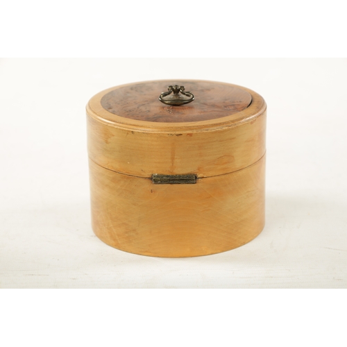 391 - A 19TH CENTURY FRUITWOOD CYLINDRICAL TEA CADDY with burr yew wood lid. (15cm diameter 11cm high)