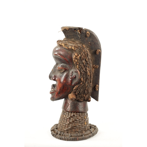 393 - AN OLD AFRICAN WICKER AND PARDIMENT TRIBAL HEAD POSSIBLY YORUBA (41cm high)